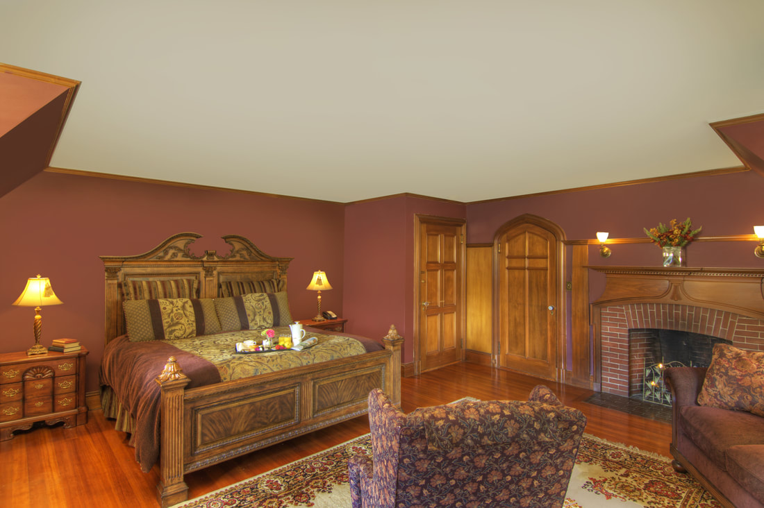 A large king bed and breakfast on a trey atop the bed